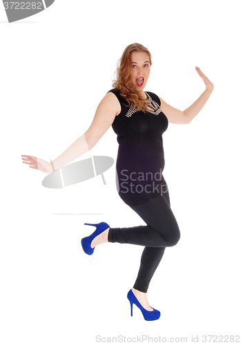 Image of Dancing woman in black tights.