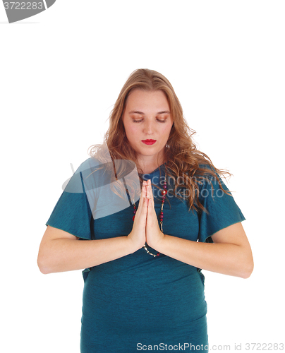 Image of Praying young woman.