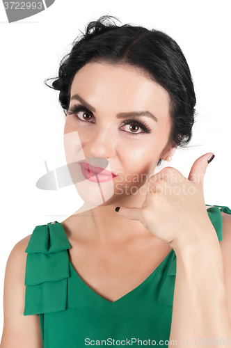 Image of Attractive woman shows Call Me Sign 