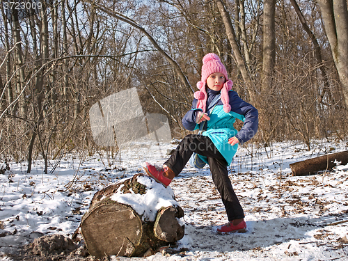 Image of Little girl in the forest in wintertime