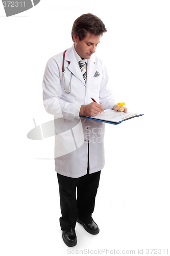 Image of Doctor writing up patient record