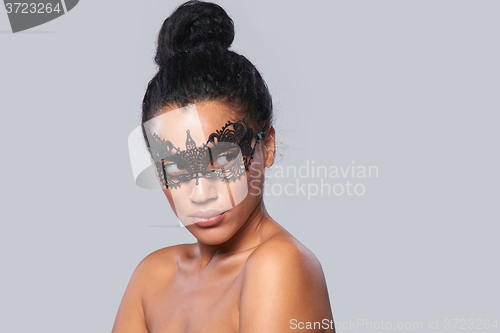 Image of Closeup portrait of beautiful mixed race with black lace mask