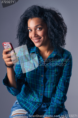 Image of Woman using her cell phone