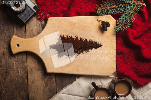 Image of The two cups of coffee on wooden background