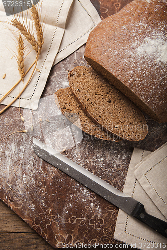 Image of Bread rye spikelets on an wooden background