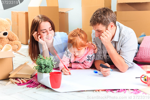 Image of The happy family  during repair and relocation