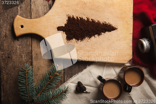 Image of The two cups of coffee on wooden background