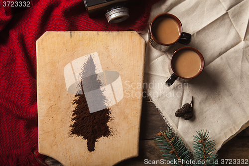 Image of The two cups of coffee on wooden background