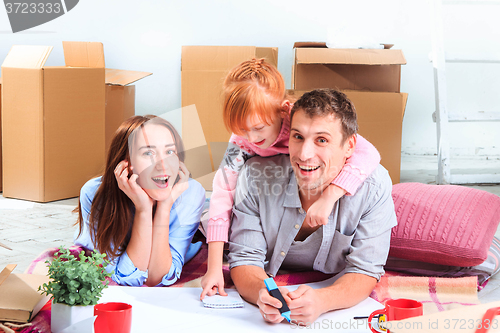 Image of The happy family  during repair and relocation