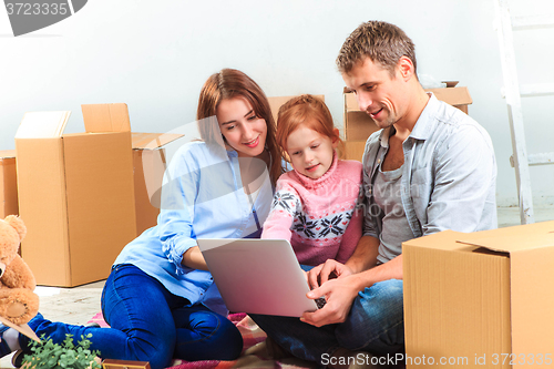 Image of The happy family  during repair and relocation