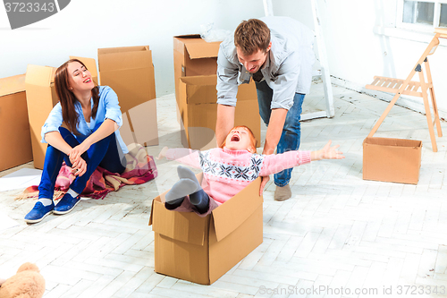 Image of The happy family  during repair and relocation