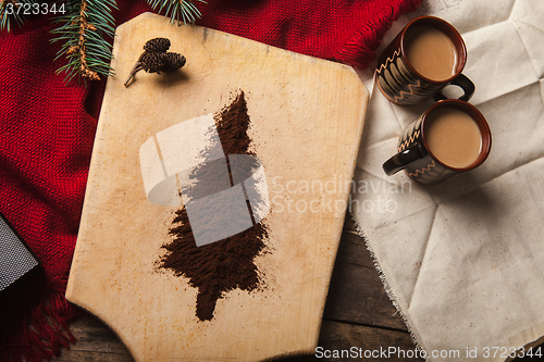 Image of The two cups of coffee on wooden background