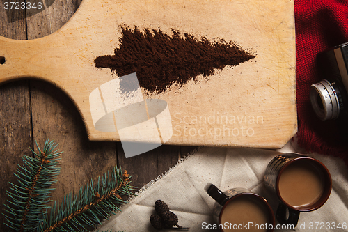 Image of The two cups of coffee on wooden background