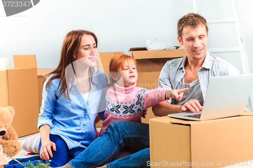 Image of The happy family  during repair and relocation