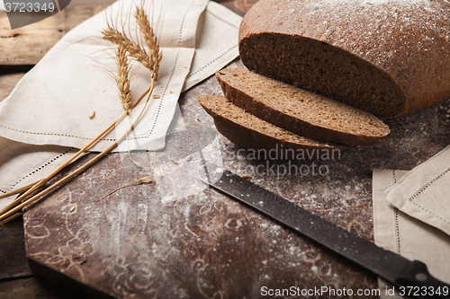 Image of Bread rye spikelets on an wooden background