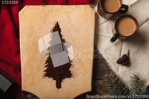 Image of The two cups of coffee on wooden background