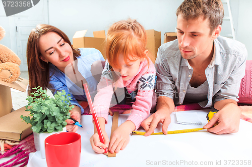 Image of The happy family  during repair and relocation