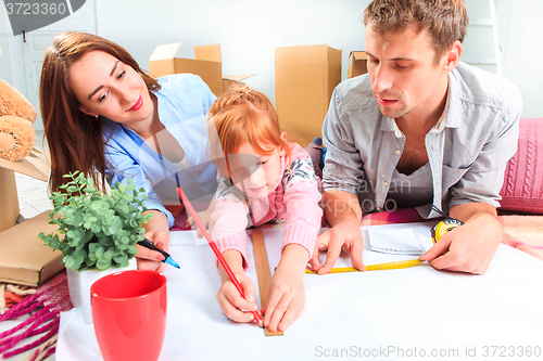 Image of The happy family  during repair and relocation