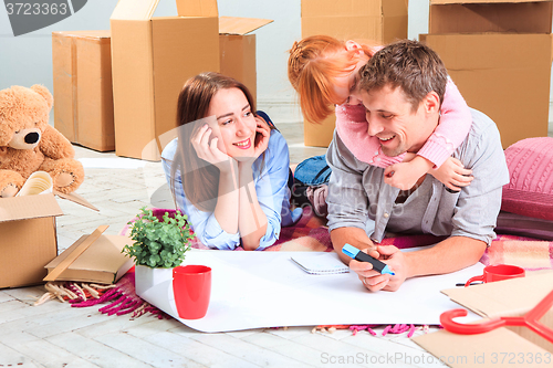 Image of The happy family  during repair and relocation