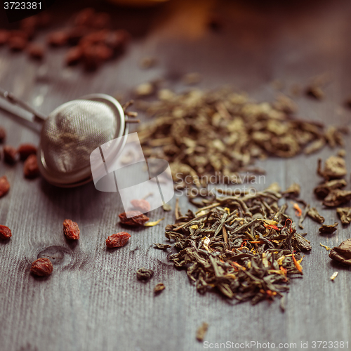 Image of berries  tea composition