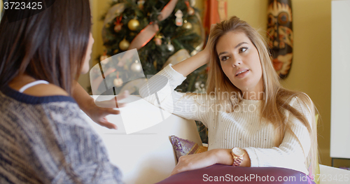 Image of Attractive woman listening to a female friend