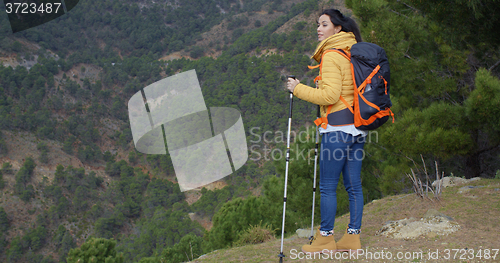 Image of Young woman enjoying a mountain hike