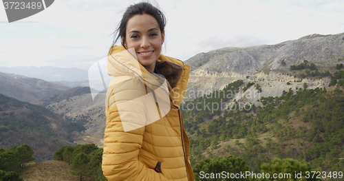 Image of Smiling woman appreciating the peace of nature