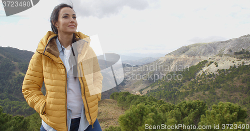 Image of Smiling woman appreciating the peace of nature