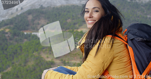 Image of Happy vivacious young woman backpacker