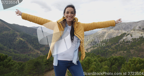 Image of Fun young woman on a mountain