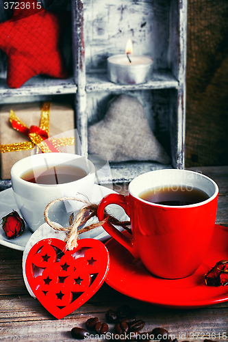 Image of Cup decorated with wooden hearts