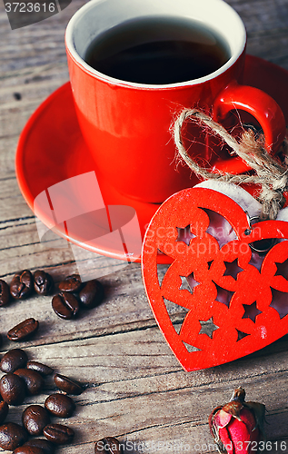 Image of Cup decorated with wooden hearts