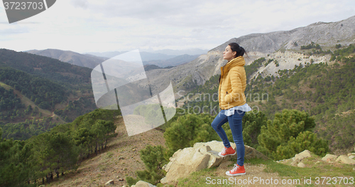 Image of Young woman on a mountain plateau