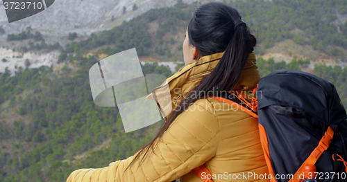 Image of Female backpacker taking a rest