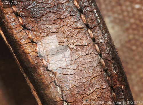 Image of Close-up of old stiches in leather