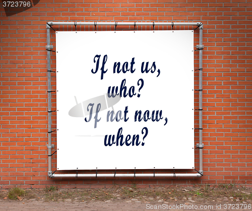 Image of Large banner with inspirational quote on a brick wall