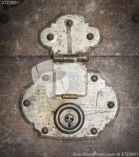 Image of Old canvas trunk lock close up