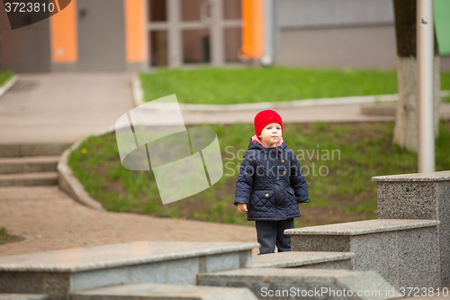 Image of happy child walking in the park