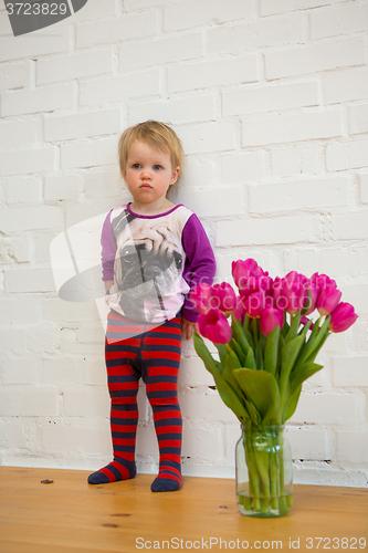 Image of child with tulips