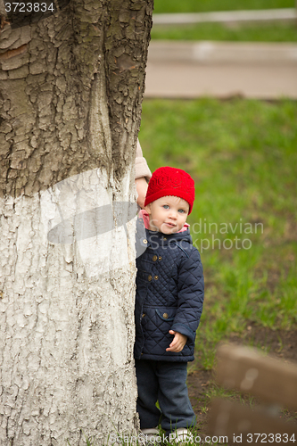 Image of happy child walking in the park