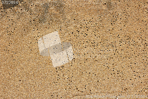 Image of closeup sand pattern of beach in the summer