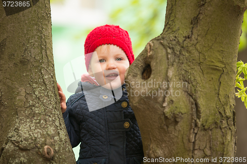 Image of happy child walking in the park