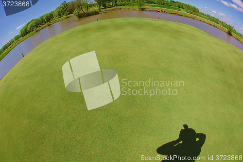 Image of Photographer shadow with grass background