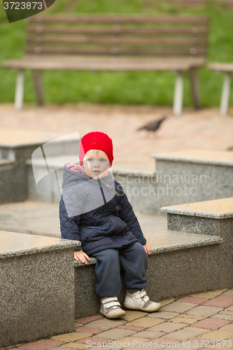 Image of happy child walking in the park