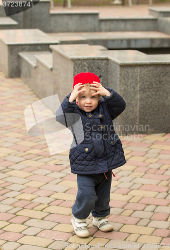 Image of happy child walking in the park