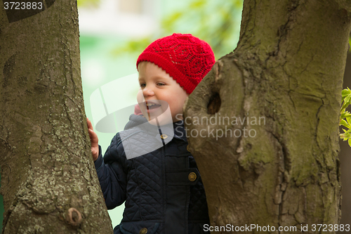 Image of happy child walking in the park