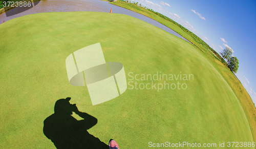 Image of Photographer shadow with grass background