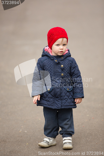 Image of little girl on a park alley