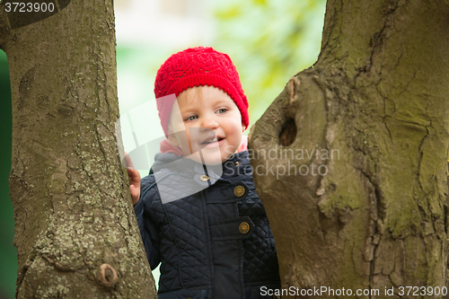 Image of happy child walking in the park