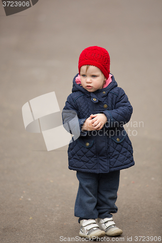 Image of little girl on a park alley